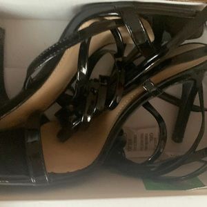 black lace up heels .